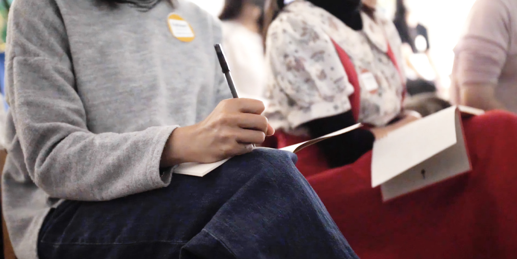 Teacher taking notes